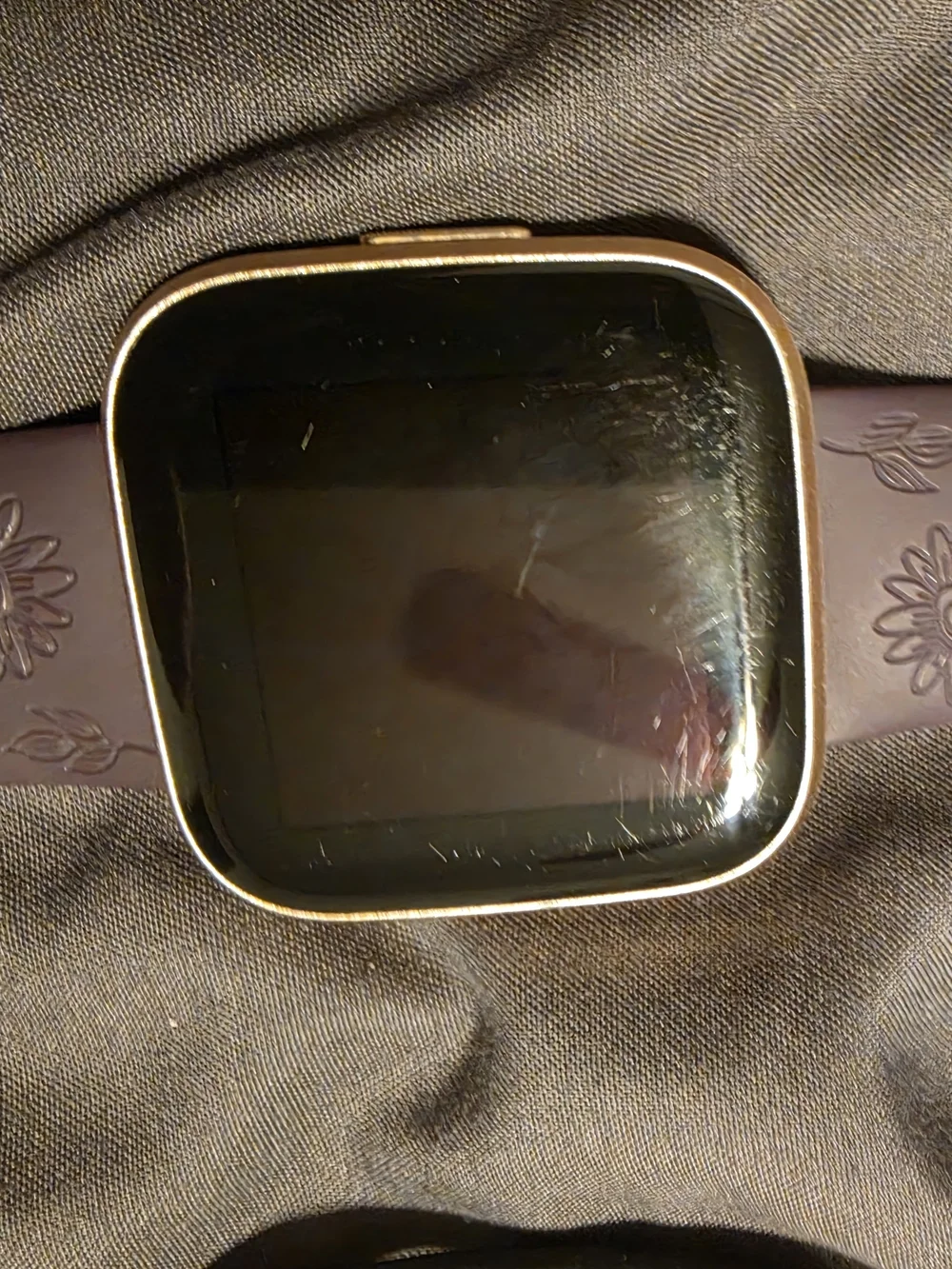 Fitbit Versa 2 Smartwatch W/ purple, pink, blue and burnt orange Straps